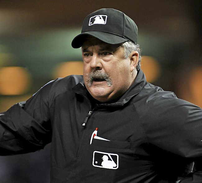 Umpire Tim Tschida during a baseball game between the Minnesota Twins and the Toronto Blue Jays Saturday, May 12, 2012, in Minneapolis. (AP Photo/Jim Mone)