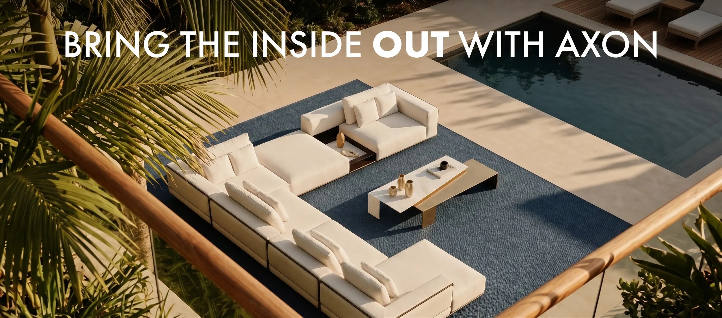 Aerial view of a white outdoor sectional on blue AXON woven vinyl flooring beside a pool, with the headline Bring the Inside Out with AXON.