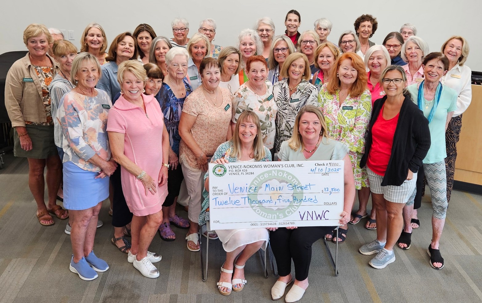 VNWC presenting a check for $12,500 to Venice MainStreet .