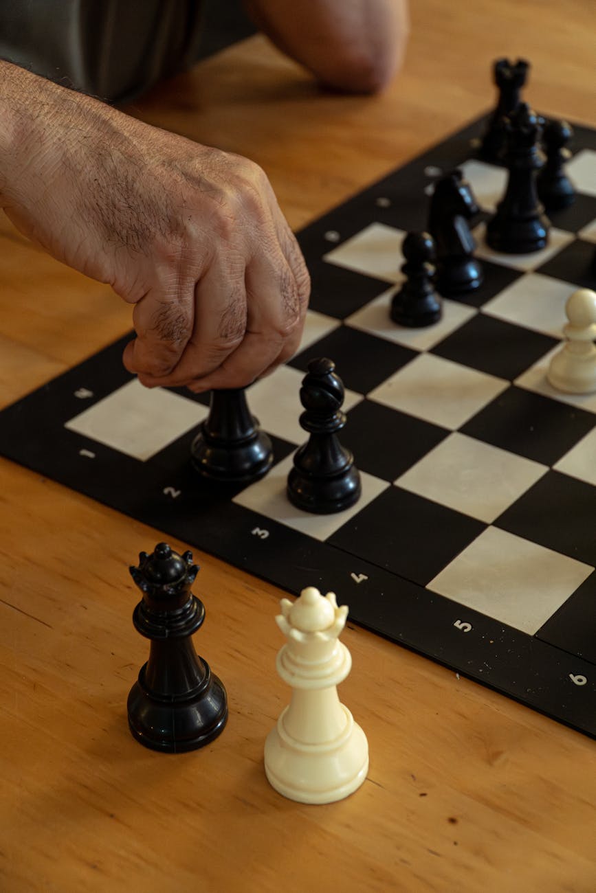 close up of a chess game mid move