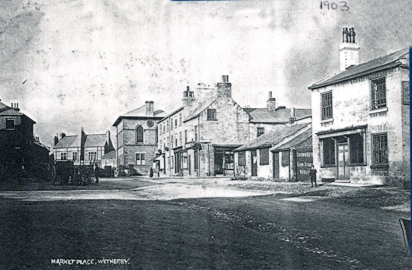 Market Place 1903 showing Crown Hotel gates & good stables.