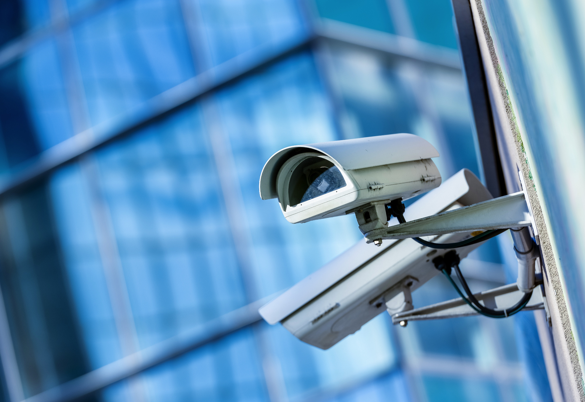 How do surveillance cameras help prevent crime?