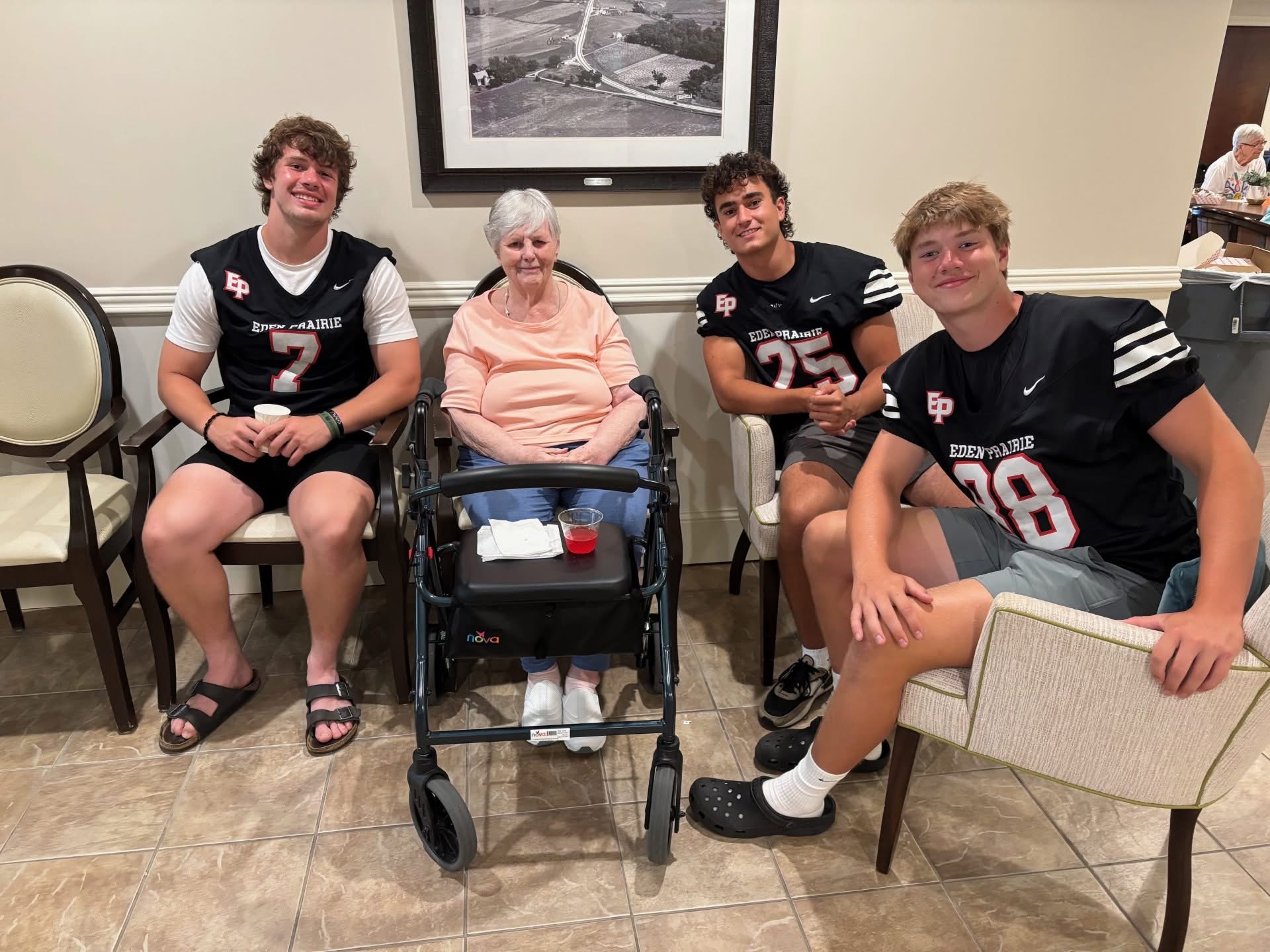 Eden Prairie High School football players lift spirits with visits to local senior living facilities