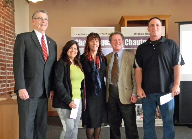 From left to right: Vince Horrigan, Chautauqua County Executive; Tracie DeMotte, contest winner; Roslin Smith, contest winner; Kevin Kearns, Vice President of Engagement and Economic Development at the State University of New York at Fredonia; and David Saxton, contest winner.