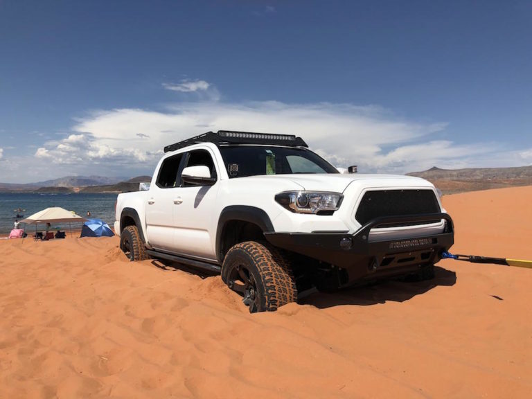 This photo of a tacoma in the sand isn't exactly what it seems