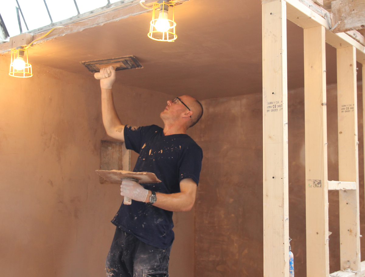 Plastering a ceiling