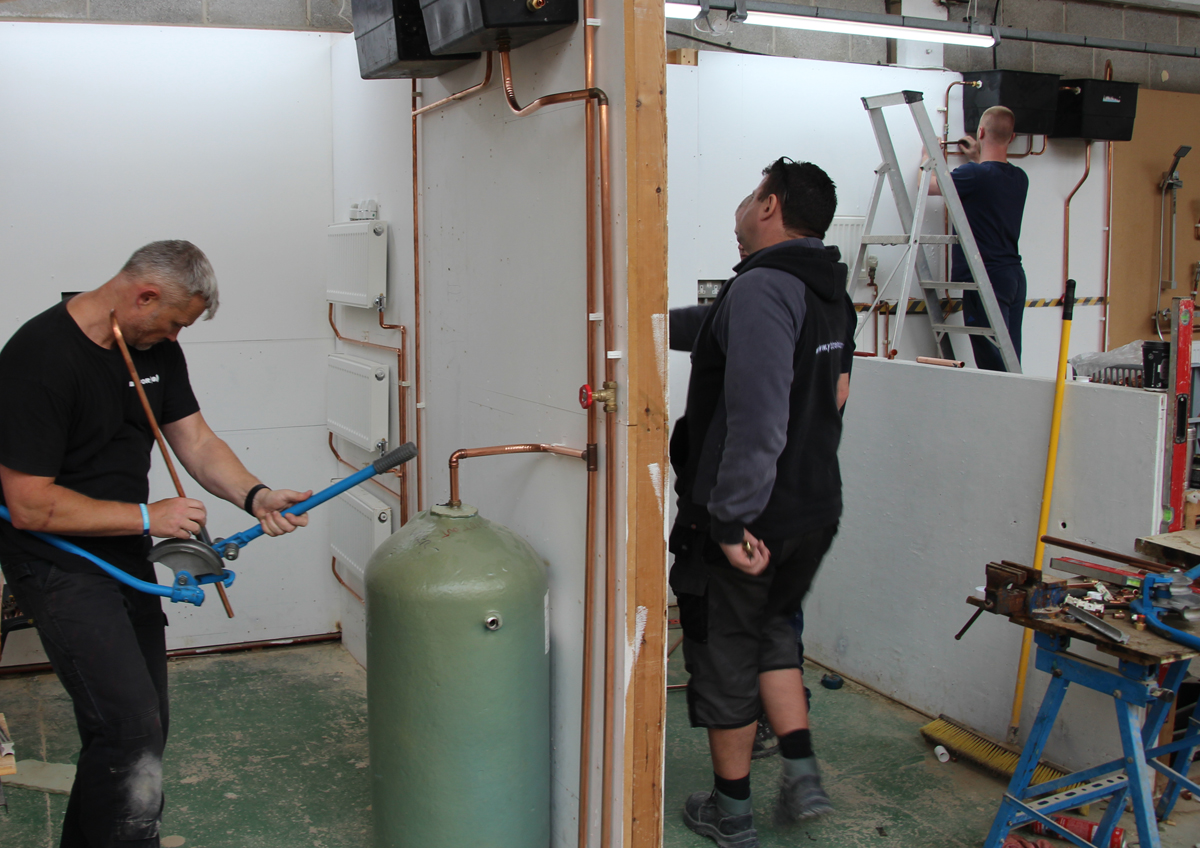 Pipe bending to hot water cylinder
