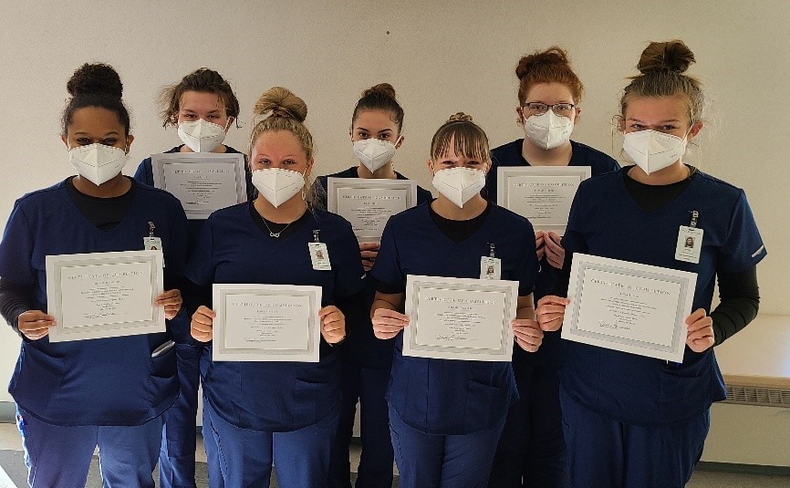 Health students with certificates