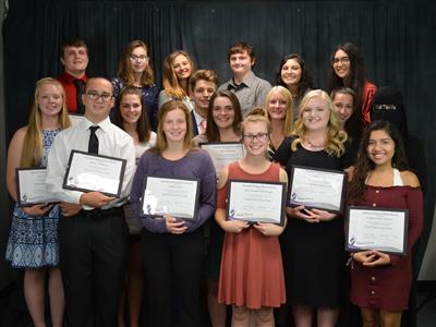 BACC NTHS Inductees holding awards.