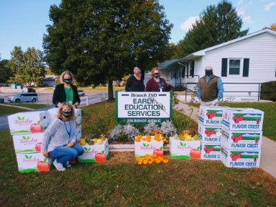 Staff with pumpkin donations