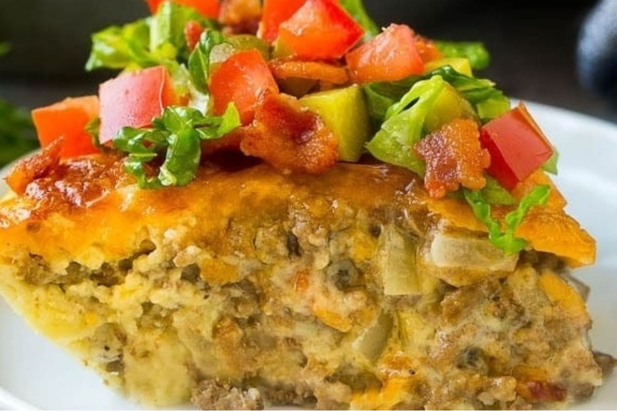 A slice of Bisquick meat and cheese quiche on a plate.
