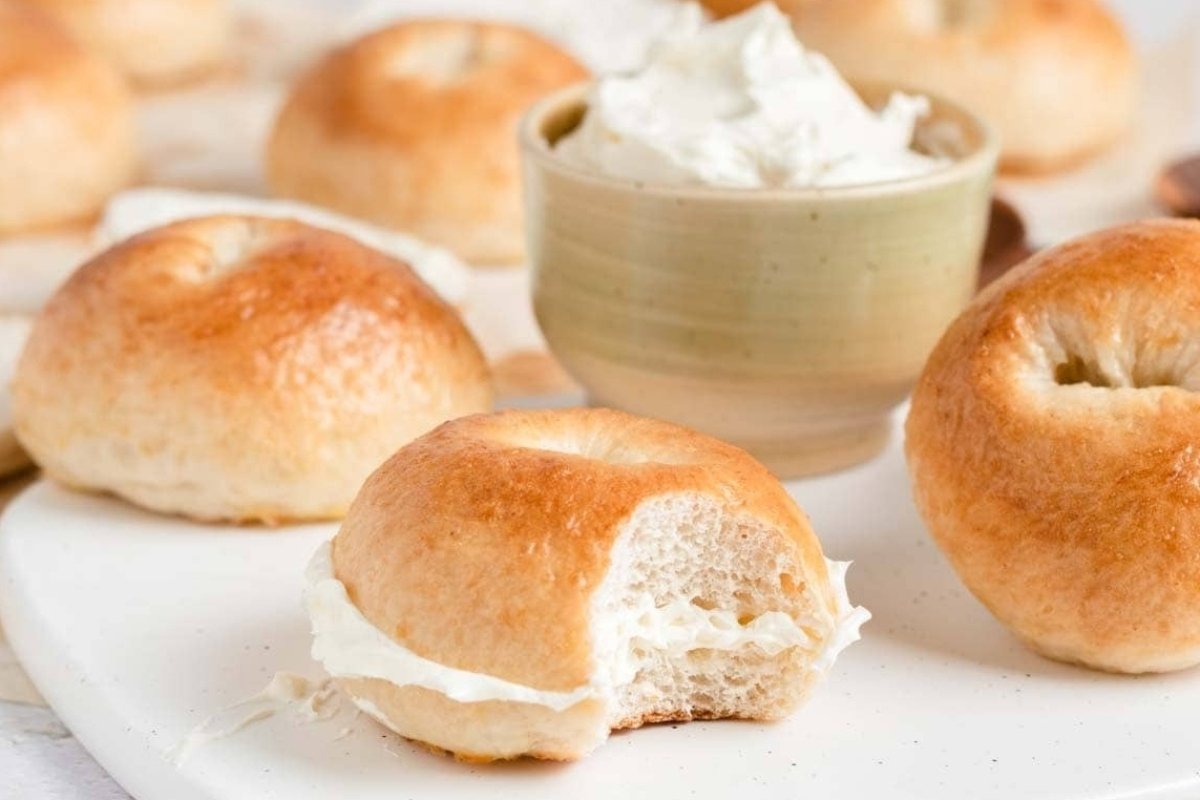 Bread recipes with cream cheese and a bowl of sour cream on a plate.