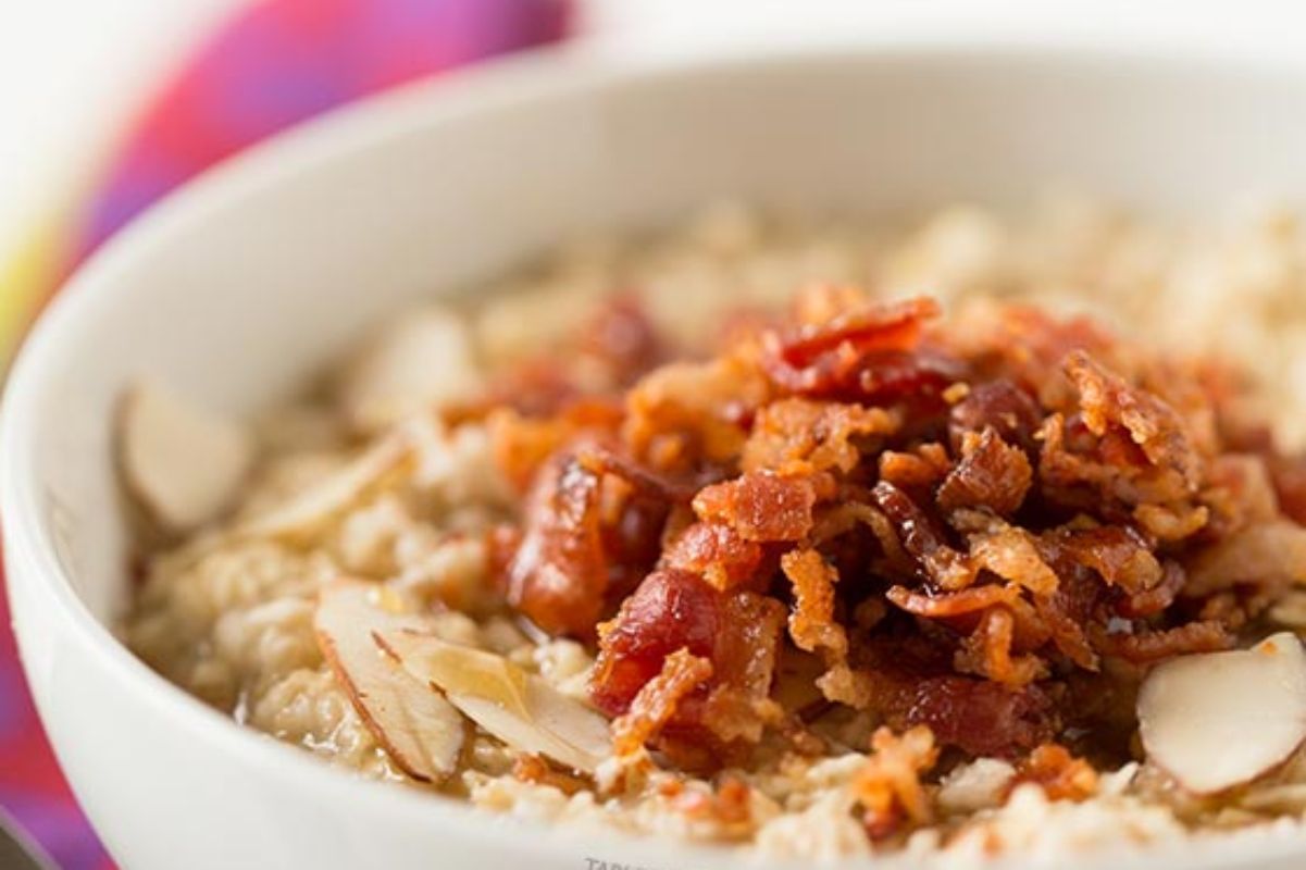 Check out this delicious bowl of oatmeal featuring bacon and almonds.