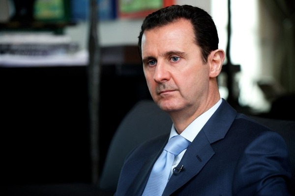 A handout picture released by the Syrian Arab News Agency (SANA) on January 15, 2015 shows Syrian President Bashar al-Assad giving an interview to the Eterarna Novina Czech newspaper in Damascus. Coalition strikes against the Islamic State group are having no impact, Assad said in an interview, as members of the US-led offensive claimed to be winning. AFP PHOTO/HO/SANA == RESTRICTED TO EDITORIAL USE - MANDATORY CREDIT "AFP PHOTO / HO / SANA" - NO MARKETING NO ADVERTISING CAMPAIGNS - DISTRIBUTED AS A SERVICE TO CLIENTS ==