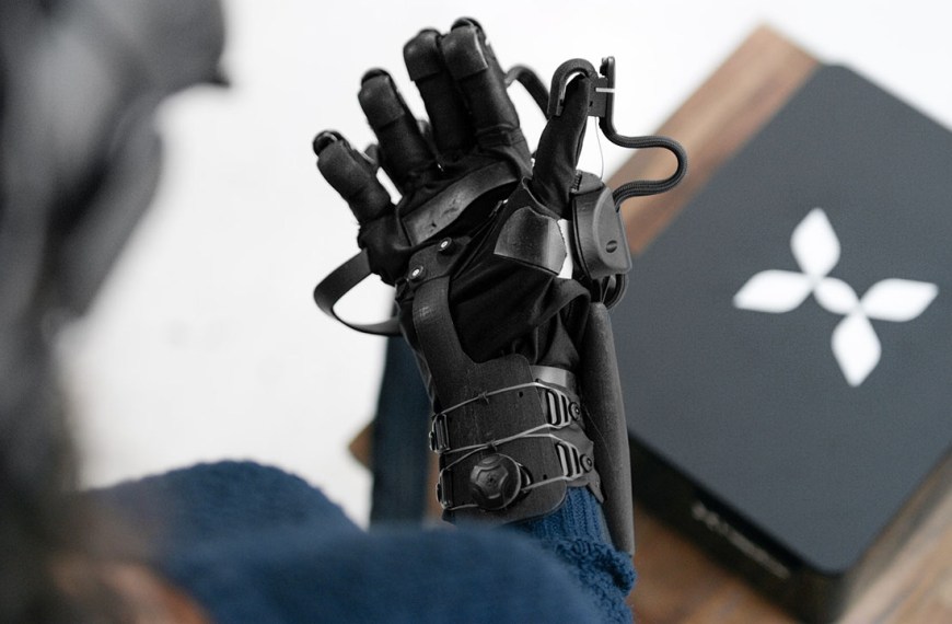 Woman wearing a HaptX brand haptic glove