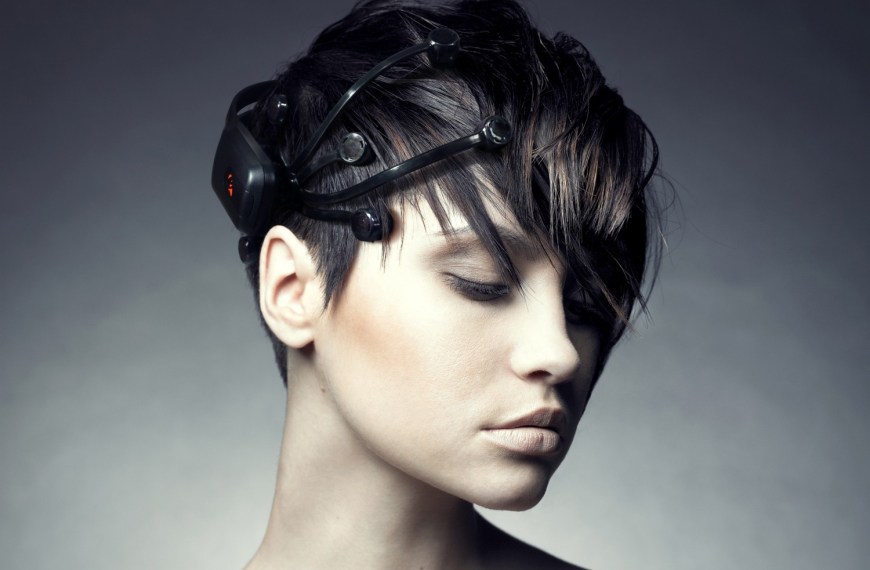 Woman wearing an Emotiv EEG sensor headset. Press photo from 2014