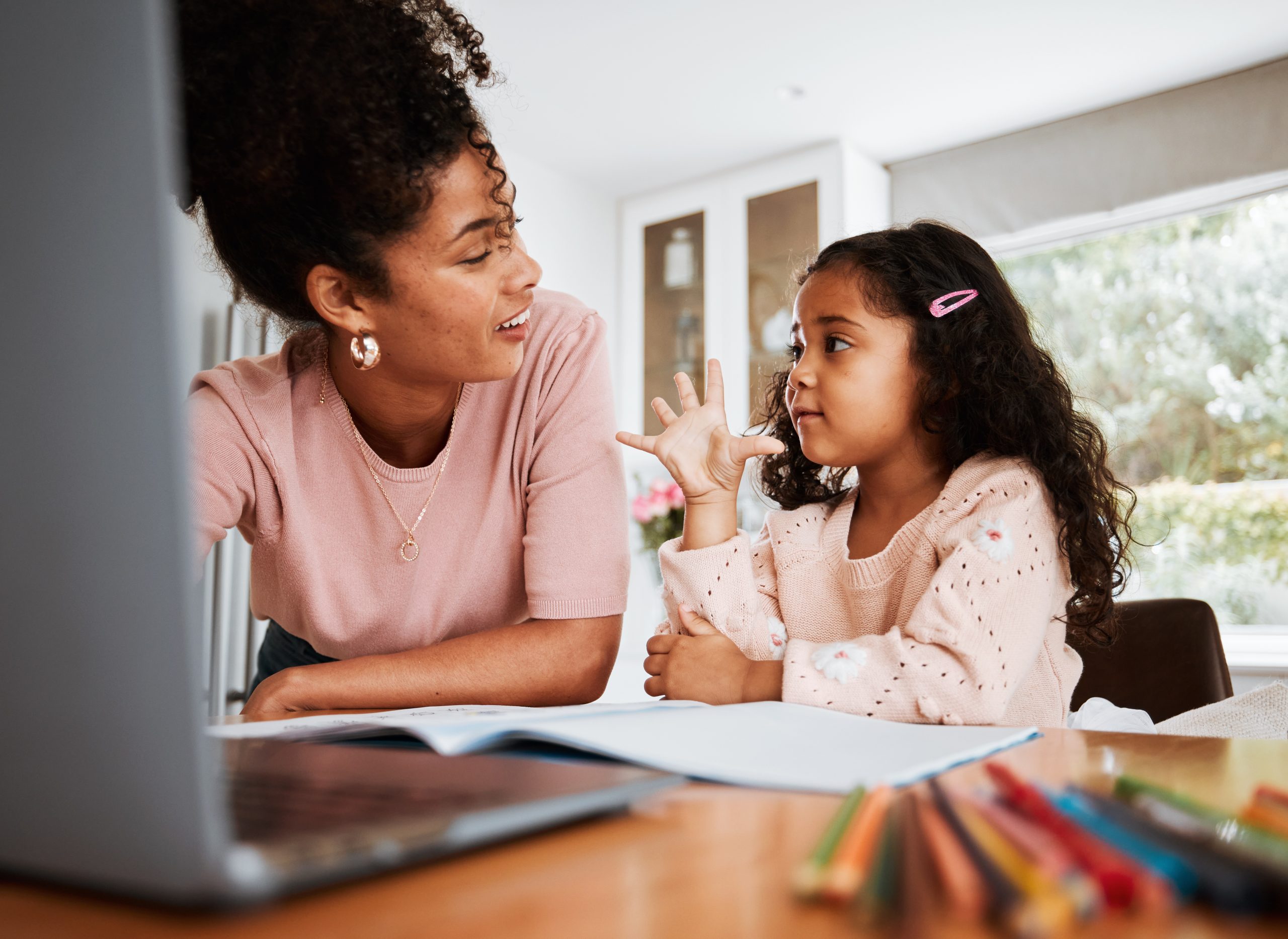 Math homework, mother and child with a laptop, counting and studying together in a house. Happy, talking and a little girl with an answer for education with a mom and a pc for elearning and knowledge.