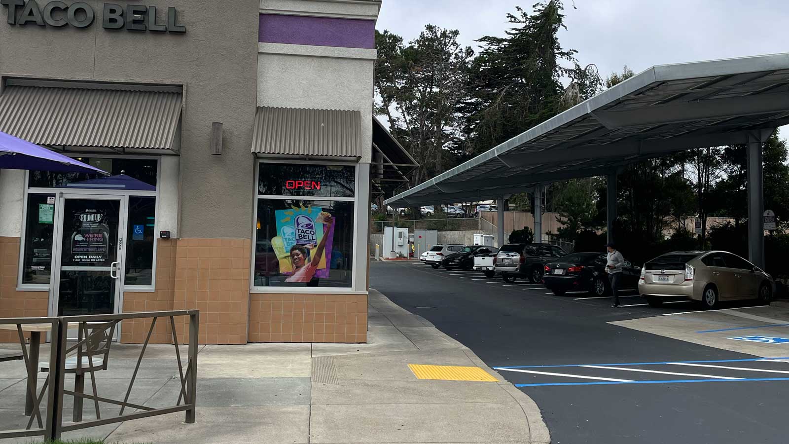 photo of cars charging near a taco bell