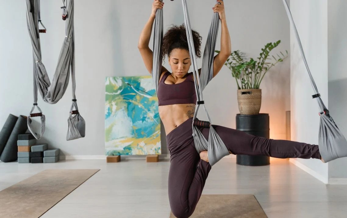 9 aerial yoga poses to take your asana to new heights