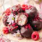 White Chocolate Raspberry Truffles are served on cake stand.