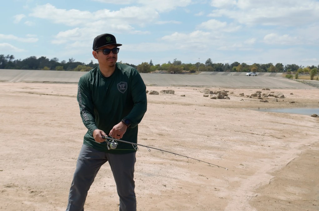 Front view of an angler casting the EdgeWalker 66MHT travel rod