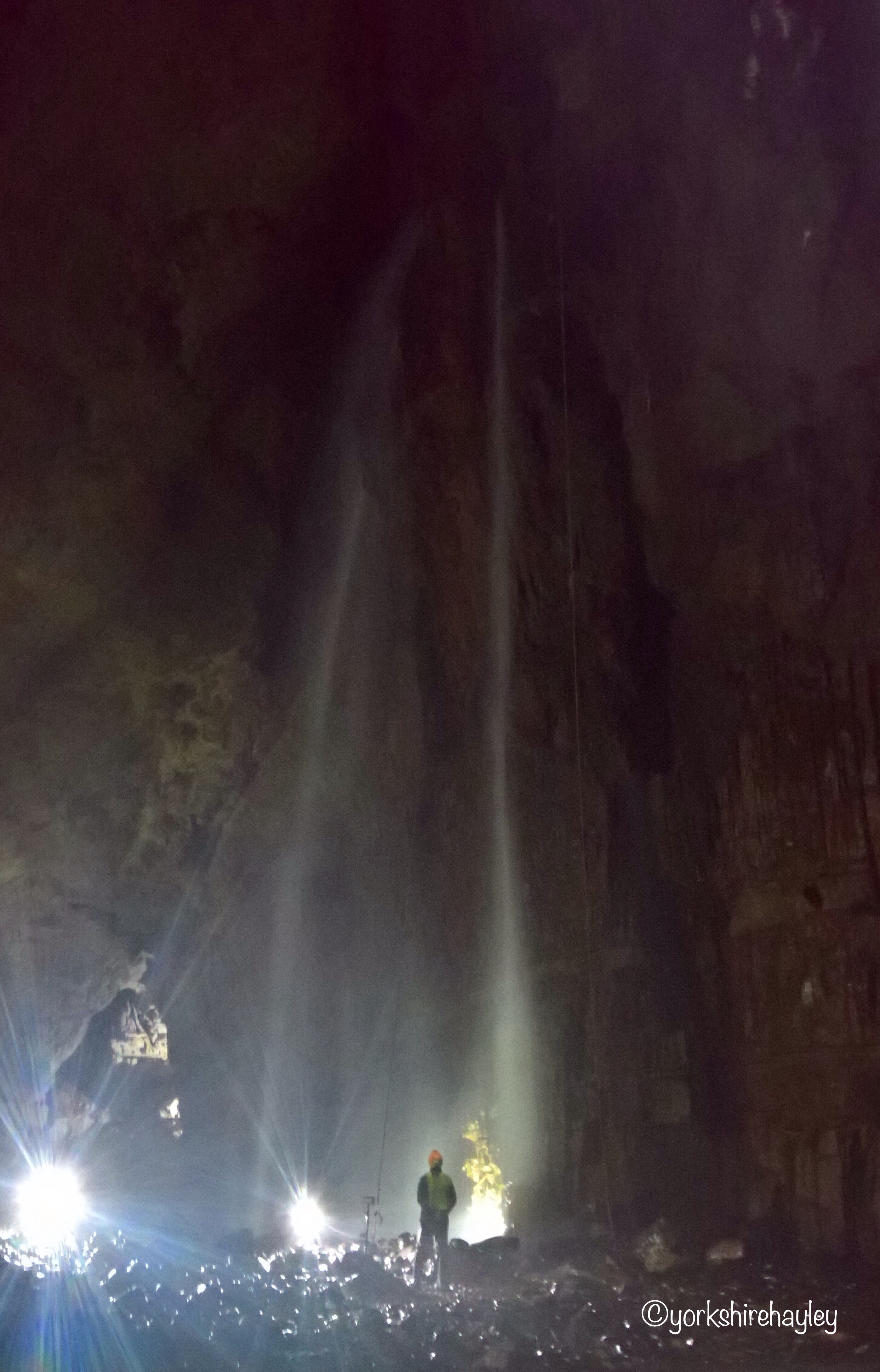You only get an impression of how high the waterfall is when someone is in front of it