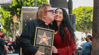 American Pie singer Don McLean, 75, kisses girlfriend Paris Dylan, 27, while receiving Walk of ...