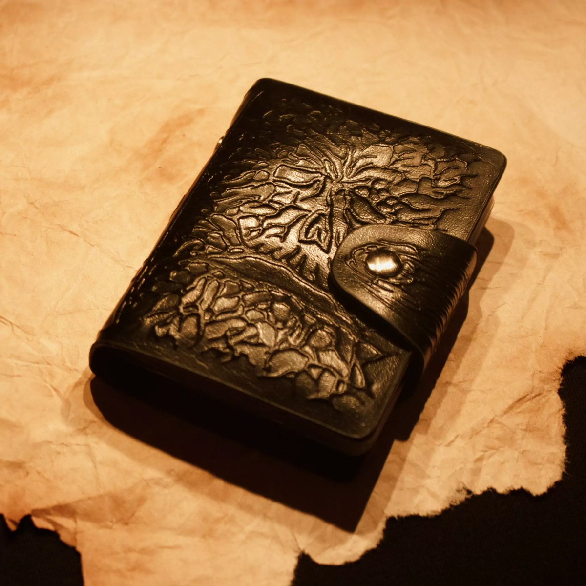 Zack Marsh Design, pocket compendium product photography on torn parchment with horror props around it