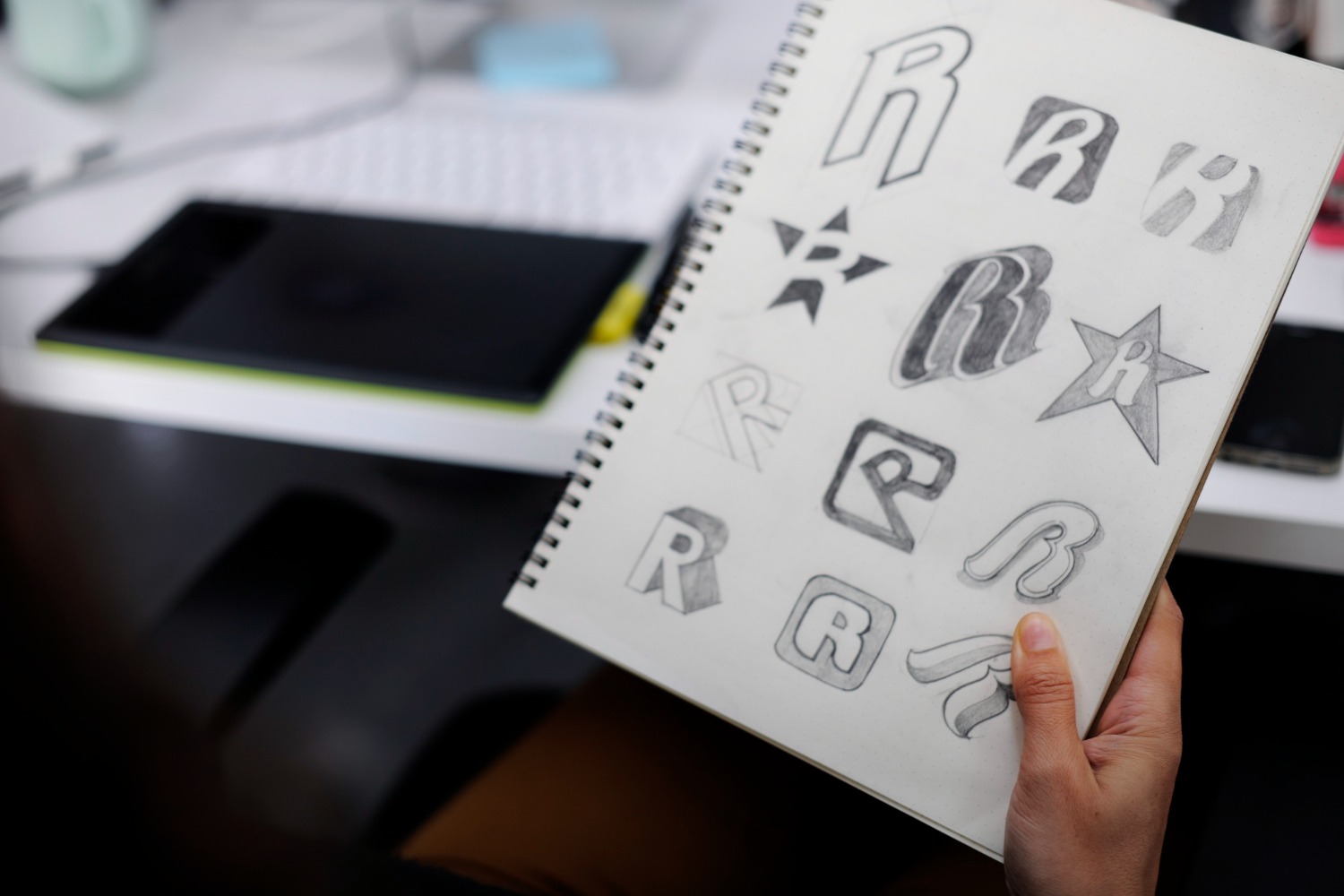 Drawing preliminary logo sketches (Source: Freepik)