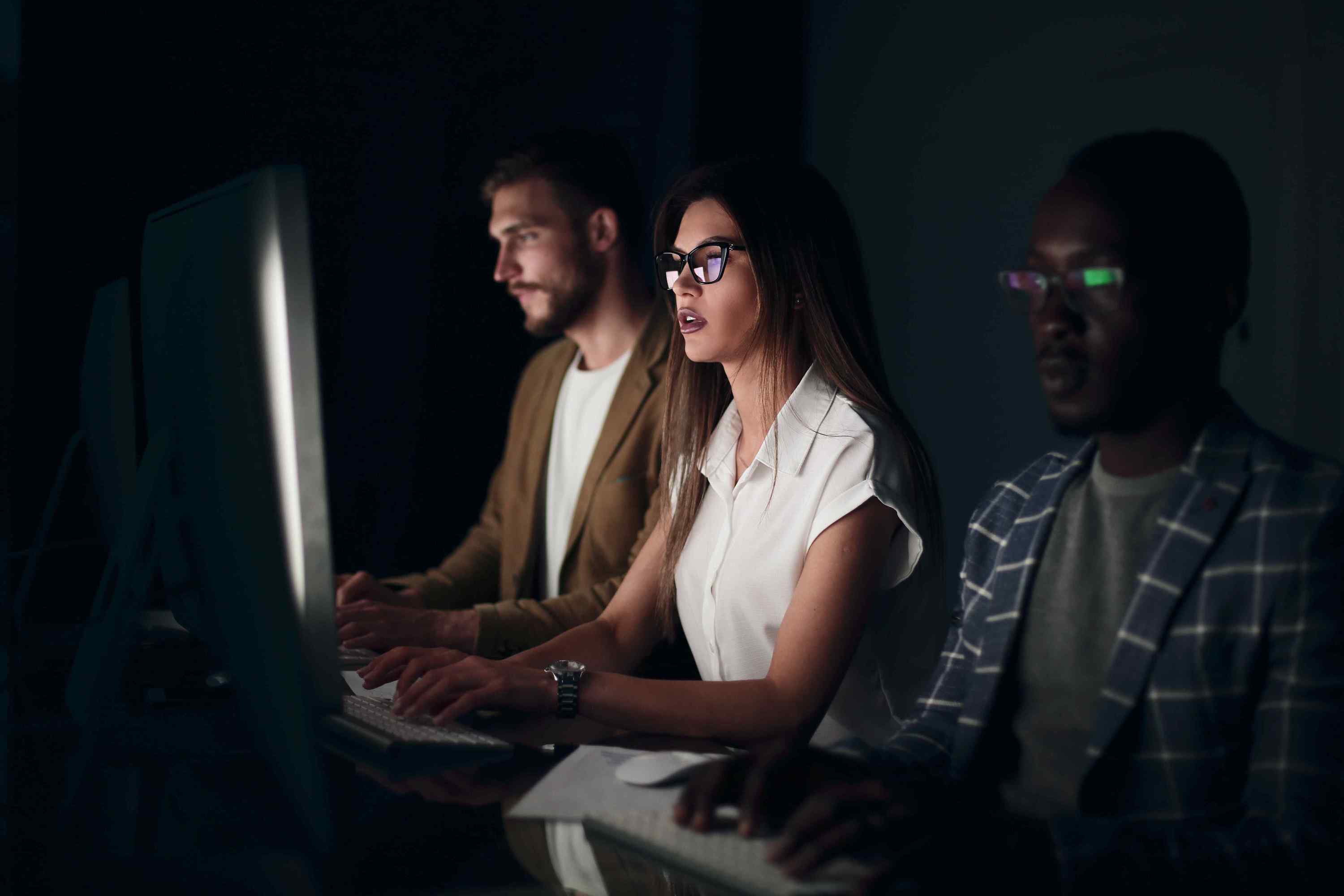 Colleagues working late monitoring a cyber attack