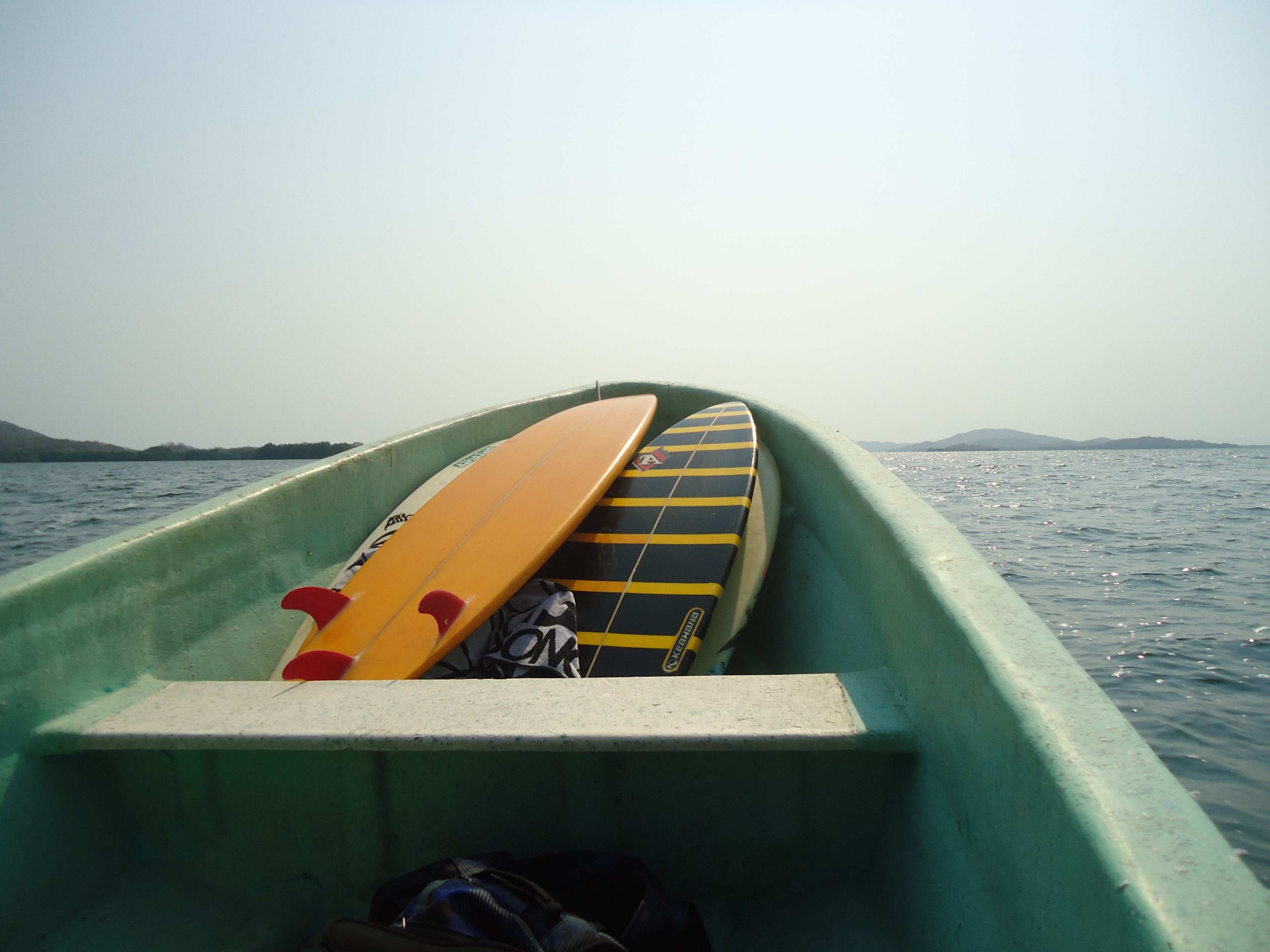surf boards on the boat to hidden waves near puerto escondido