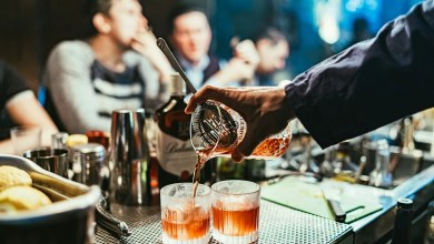 man pouring drink
