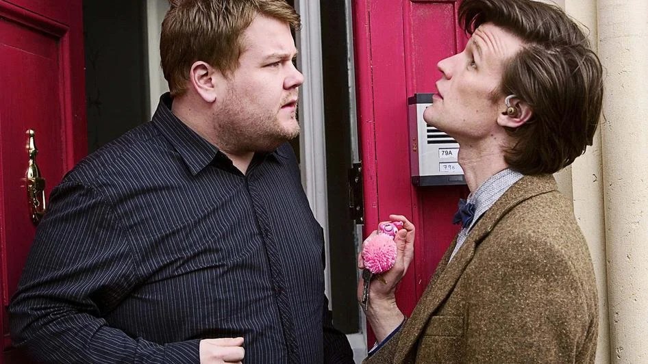 James Corden as Craig Owens and Matt Smith's Doctor at the front door in The Lodger